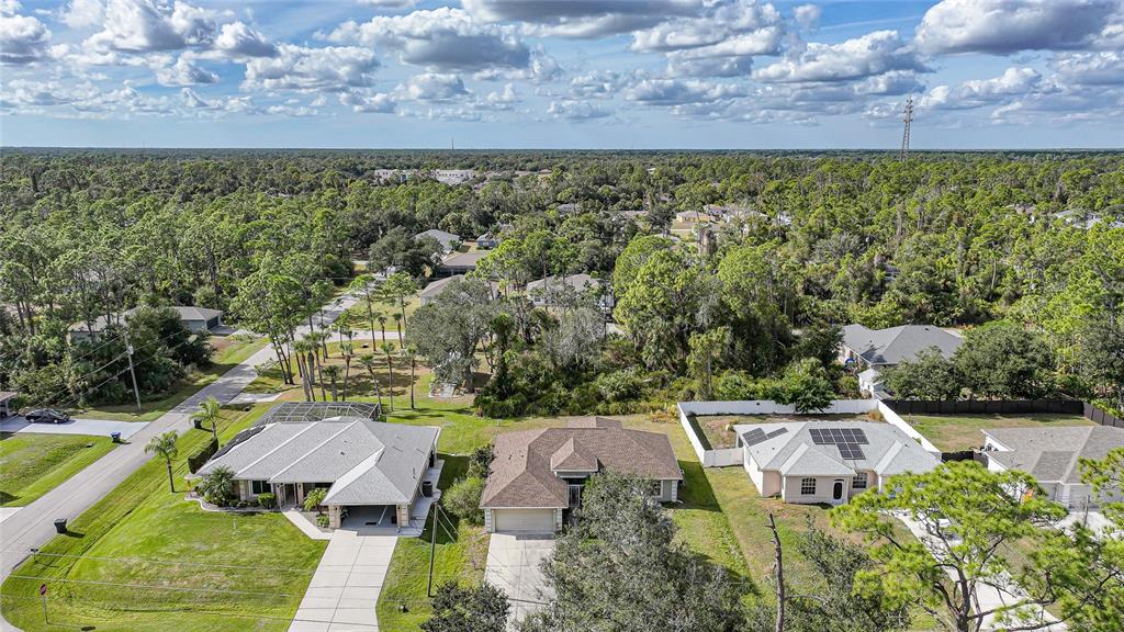 1291 Impala Street North Port, FL 34288 - Photo 44 of 44 view of a yard with an outdoor seating