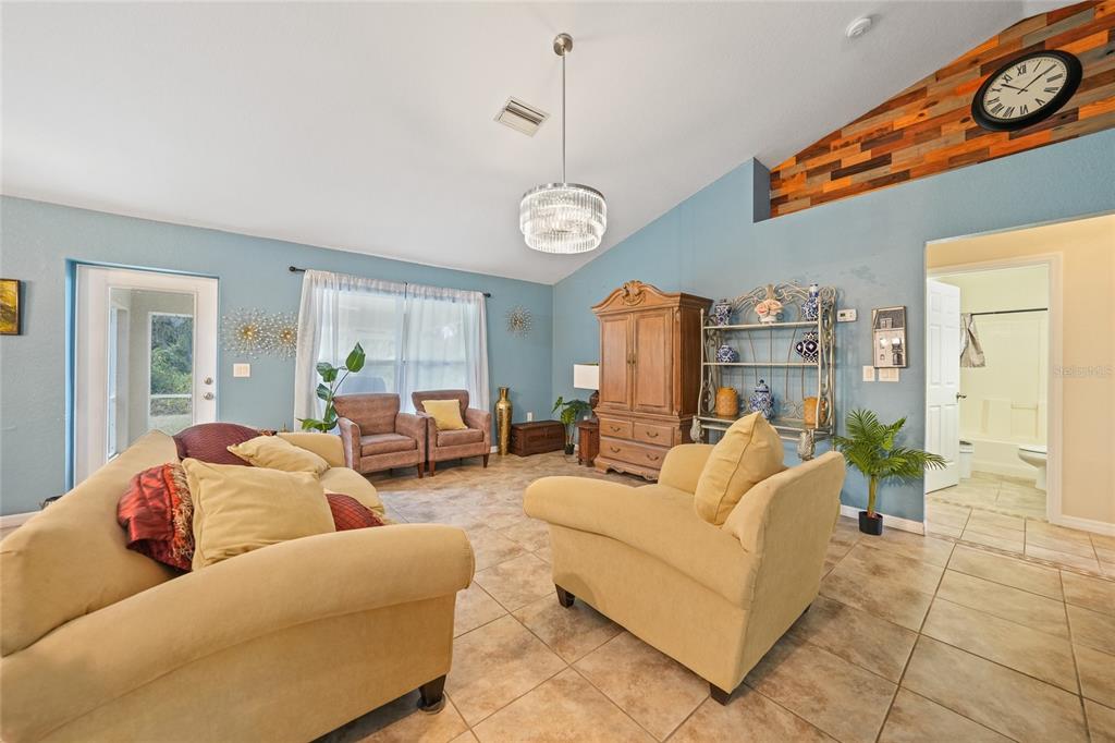 1291 Impala Street North Port, FL 34288 - Photo 7 of 44 a living room with furniture a table and chairs