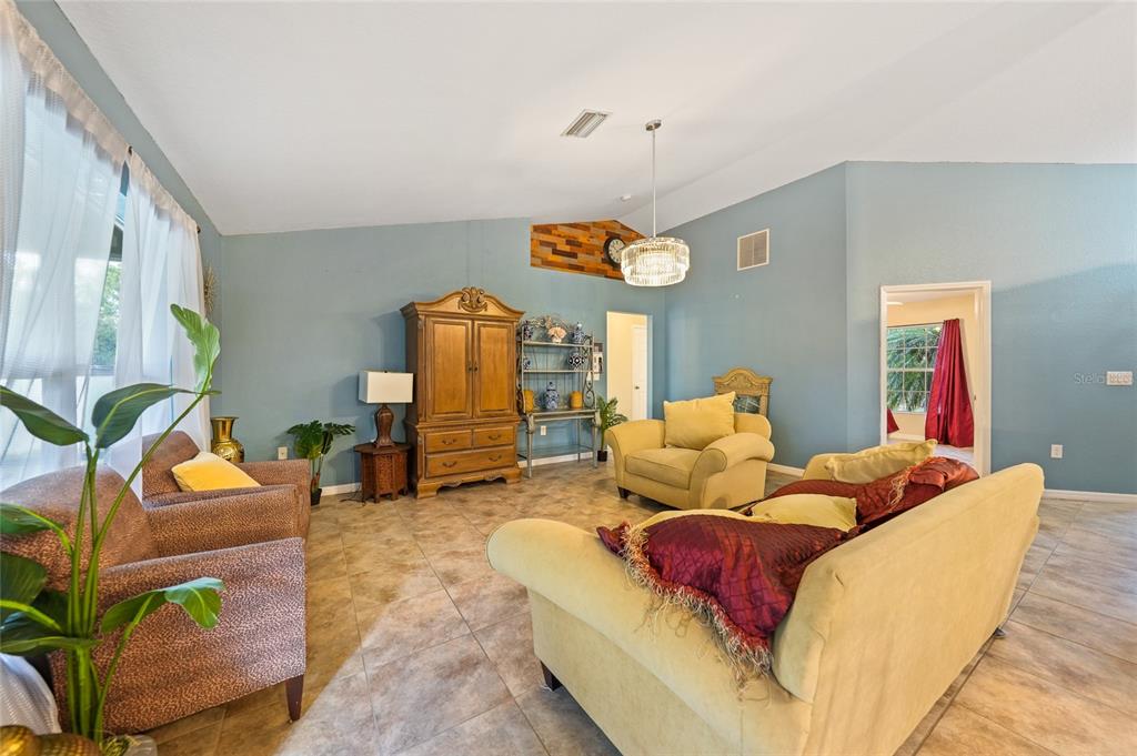 1291 Impala Street North Port, FL 34288 - Photo 9 of 44 a living room with furniture and a table