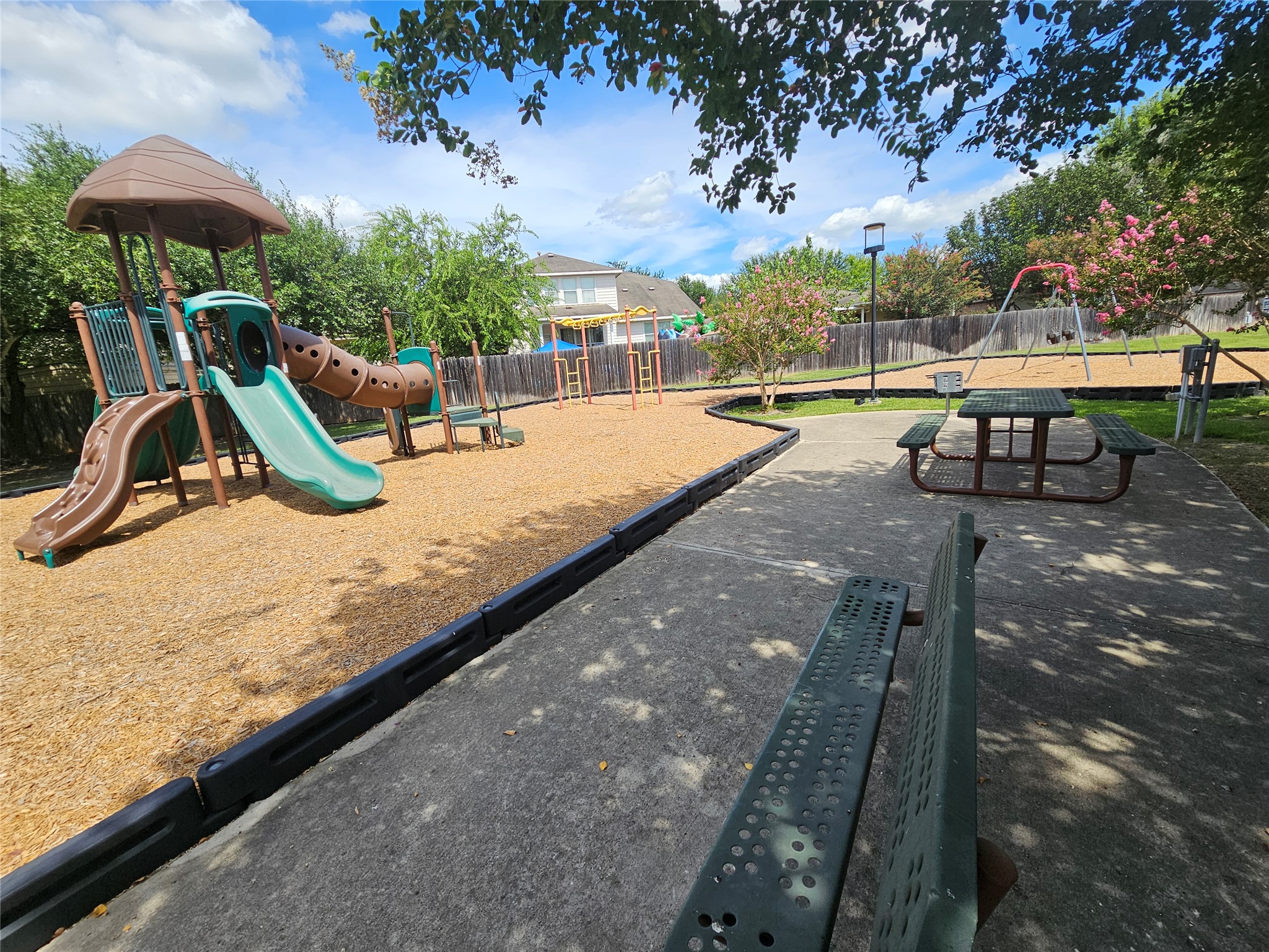 2035 Intrepid Drive Buda, TX 78610 - Photo 26 of 26 A vibrant neighborhood park offers children a dynamic playscape and swings.