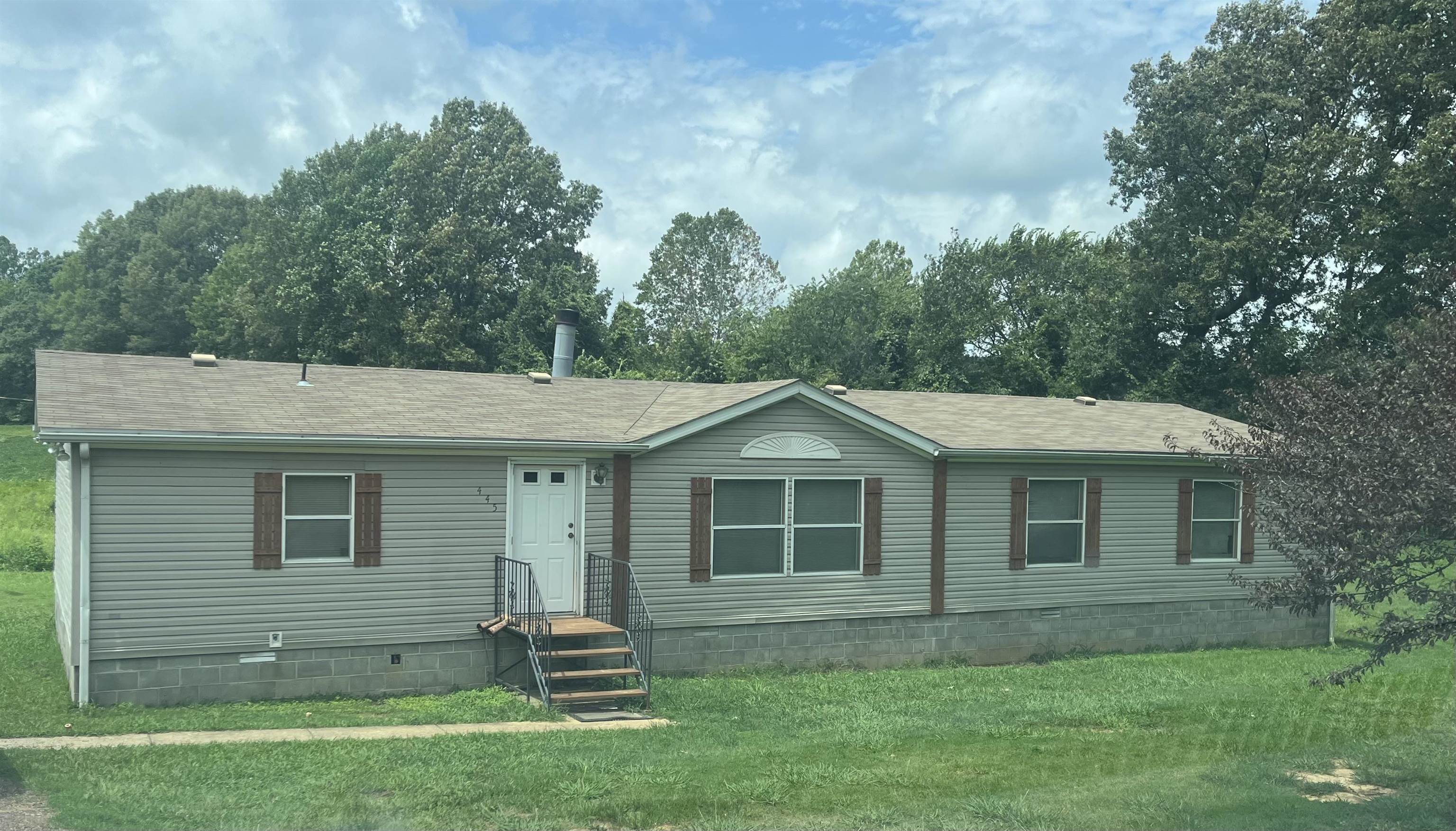 445 Junius Lee Road Ripley, TN 38063 - Photo 1 of 17 a front view of a house with a yard