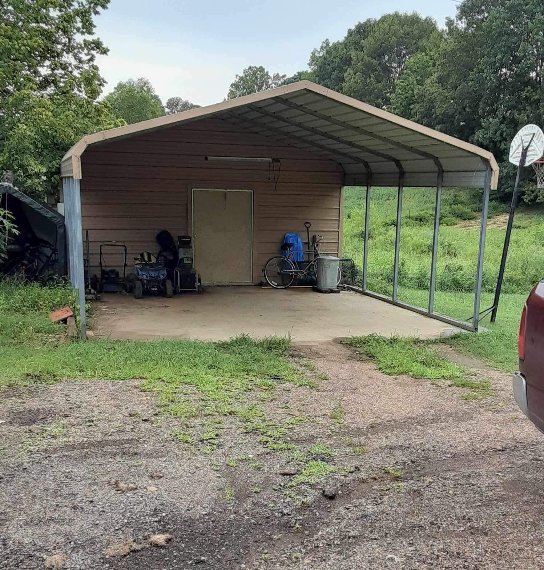 445 Junius Lee Road Ripley, TN 38063 - Photo 12 of 17 a view of a house with backyard