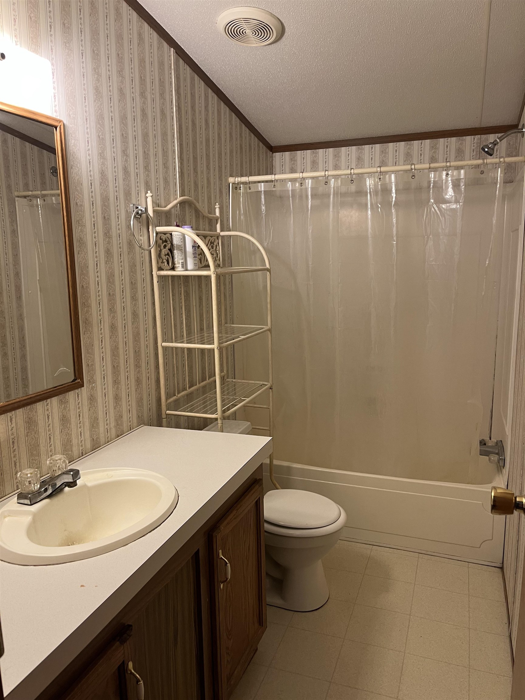 445 Junius Lee Road Ripley, TN 38063 - Photo 13 of 17 a bathroom with a sink a toilet and shower