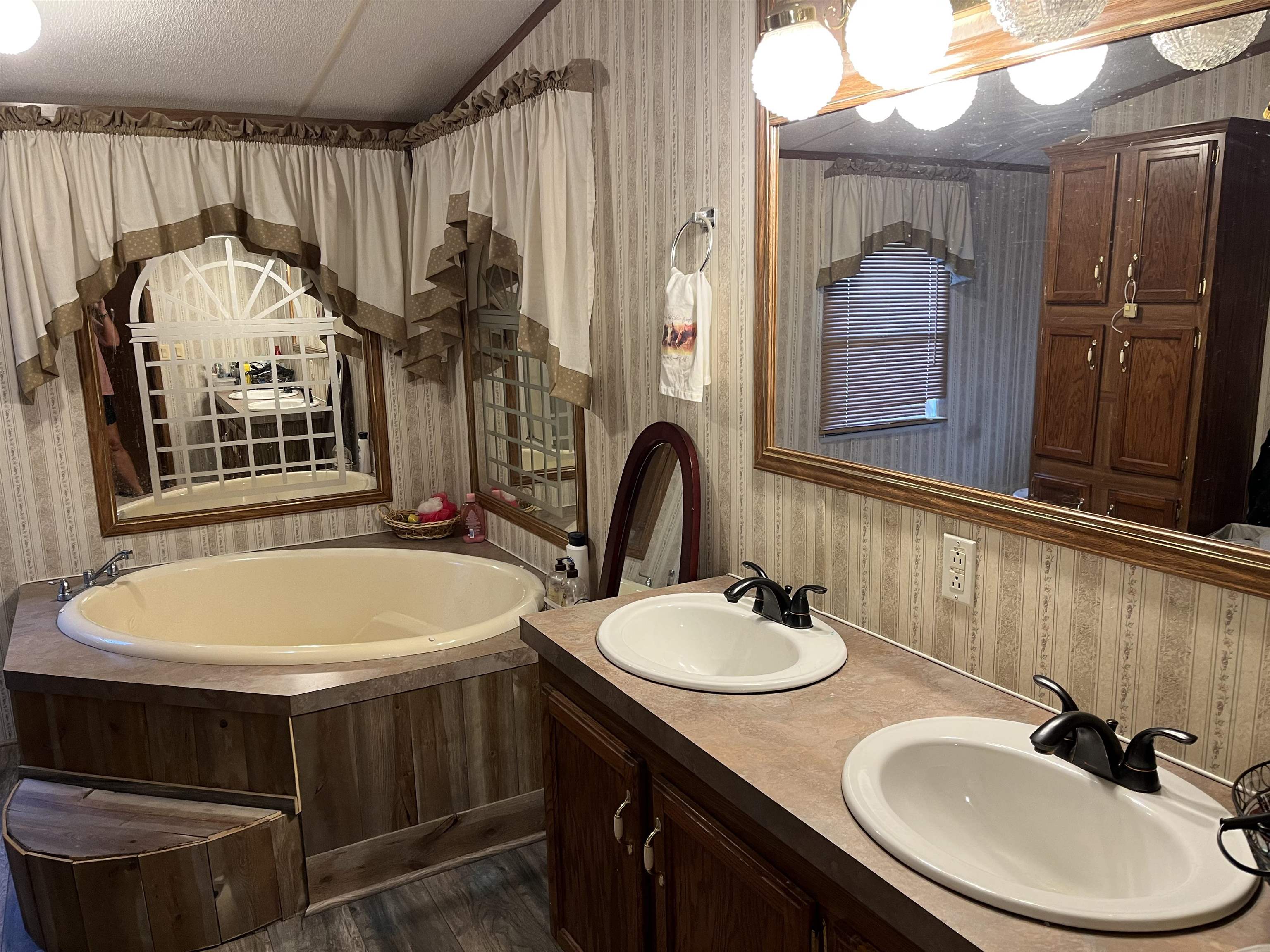 445 Junius Lee Road Ripley, TN 38063 - Photo 14 of 17 a bathroom with a sink and a mirror