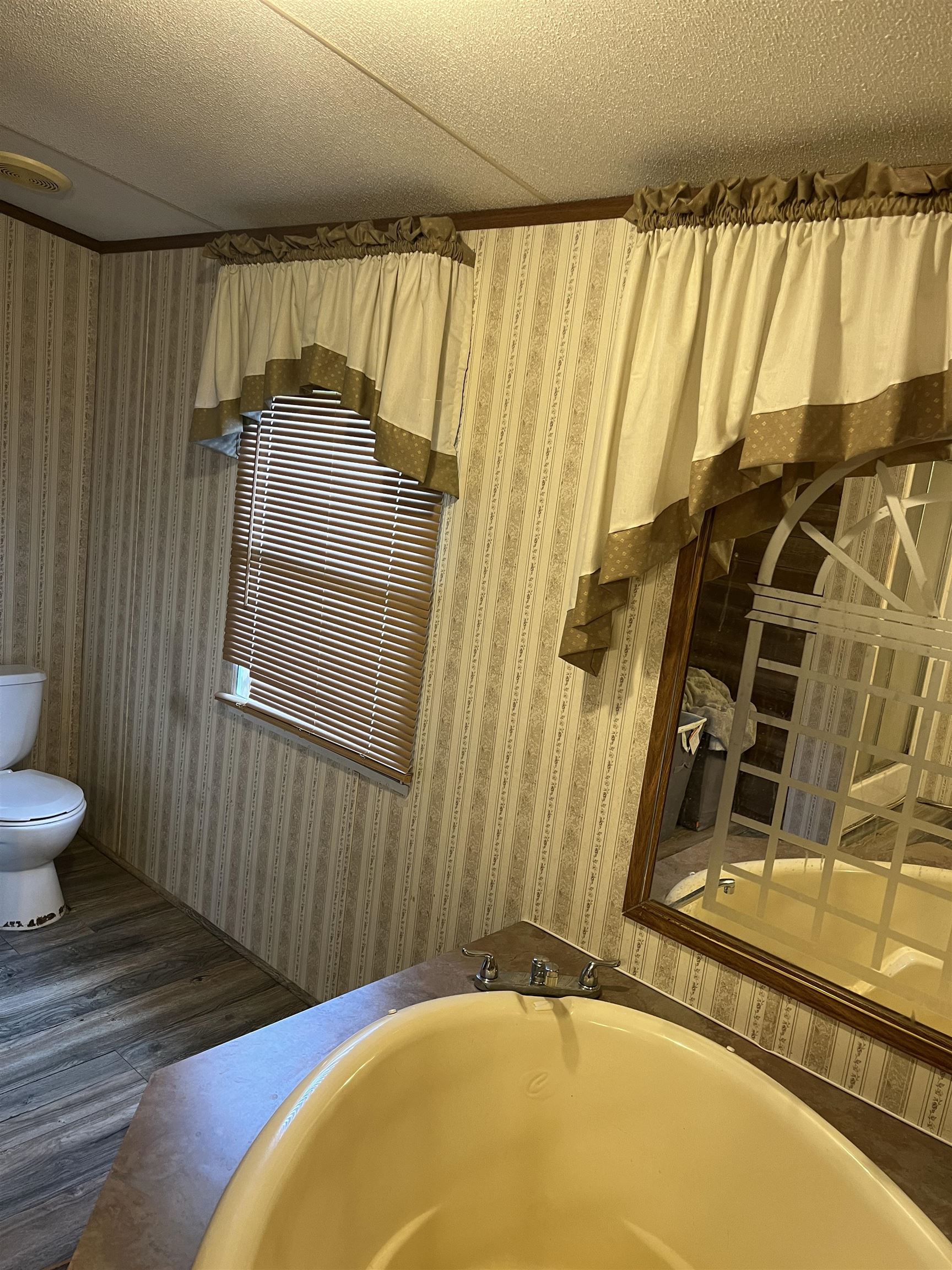 445 Junius Lee Road Ripley, TN 38063 - Photo 16 of 17 a bathroom with a sink and a mirror