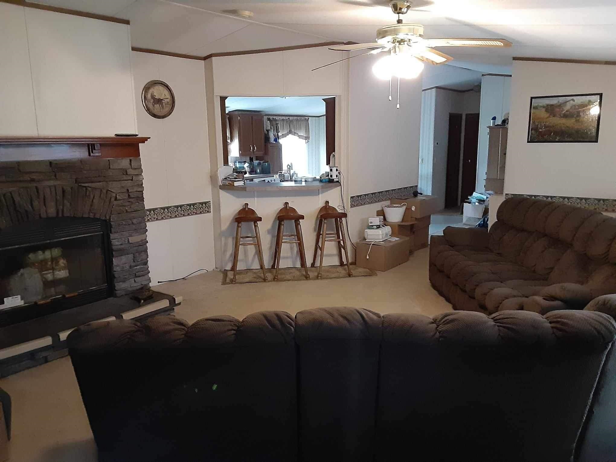 445 Junius Lee Road Ripley, TN 38063 - Photo 17 of 17 a living room with furniture and a fireplace