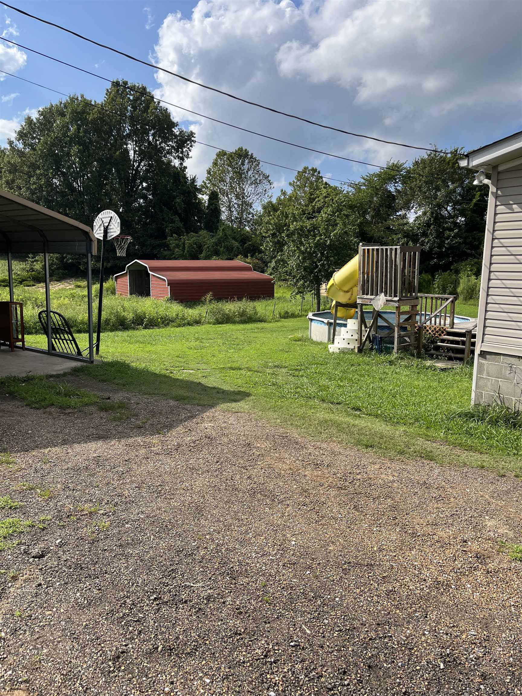 445 Junius Lee Road Ripley, TN 38063 - Photo 4 of 17 a view of a house with a yard and sitting area