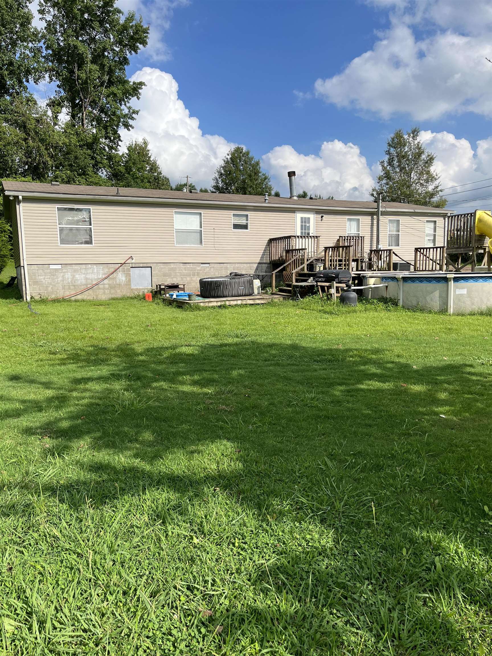 445 Junius Lee Road Ripley, TN 38063 - Photo 5 of 17 a view of outdoor space with garden and deck