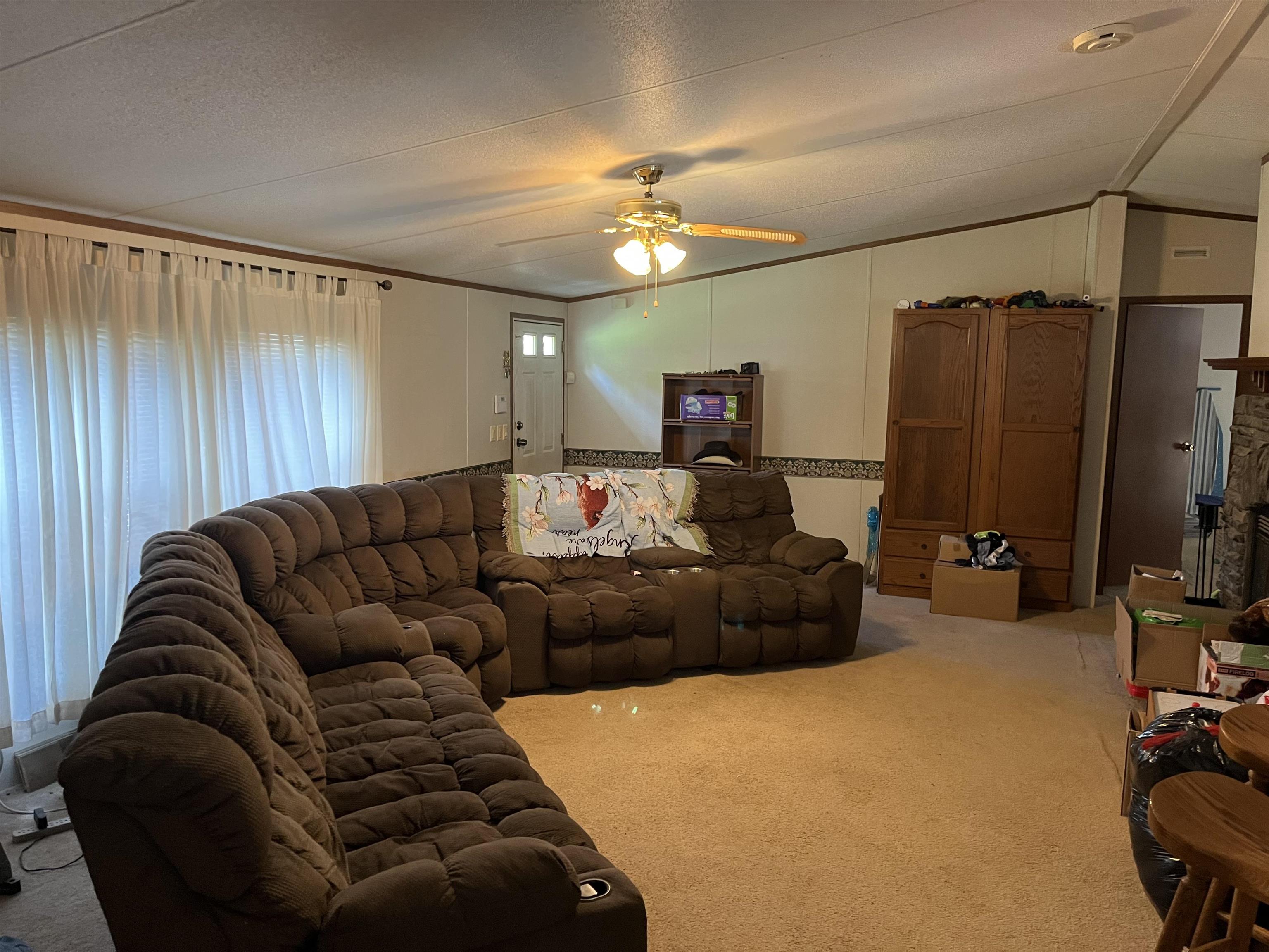 445 Junius Lee Road Ripley, TN 38063 - Photo 7 of 17 a living room with furniture and a flat screen tv