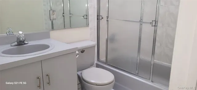a bathroom with a toilet a sink and shower
