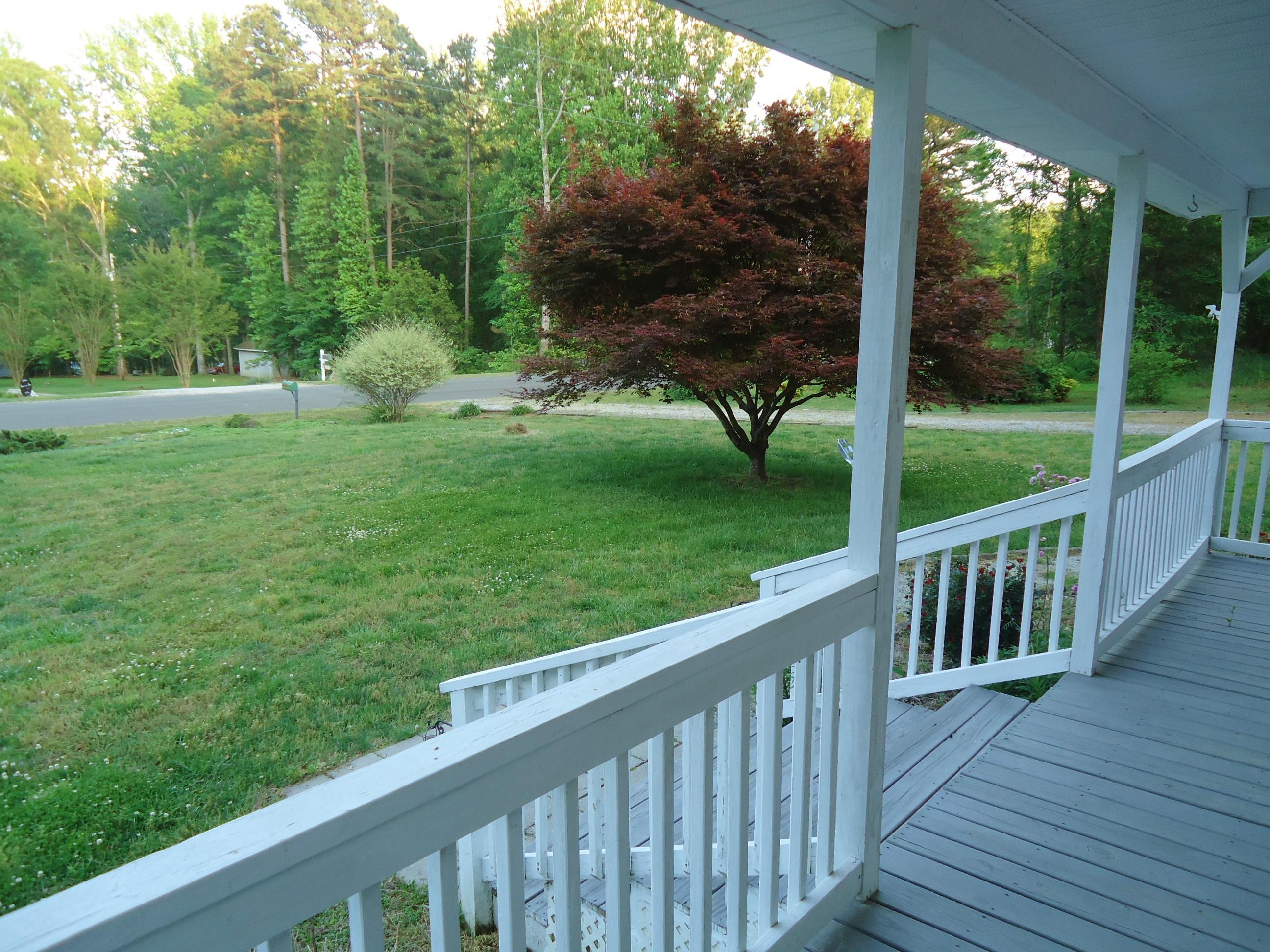 9551 George Ruff Road Bullock, NC 27507 - Photo 6 of 49 a view of a deck with a yard