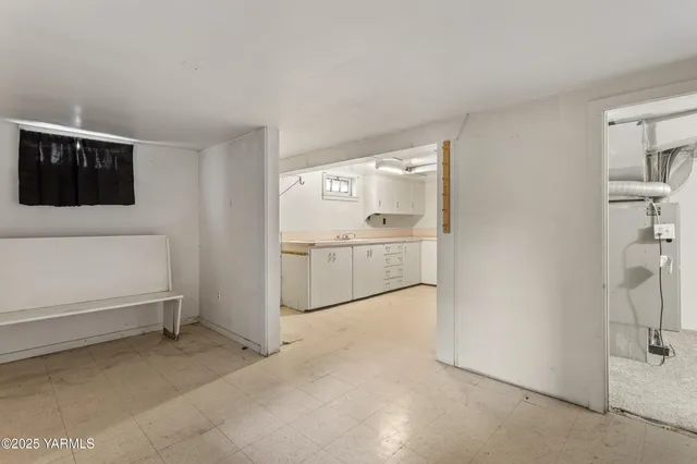 a view of a kitchen with a sink dishwasher and refrigerator