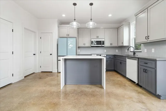 a large kitchen with cabinets