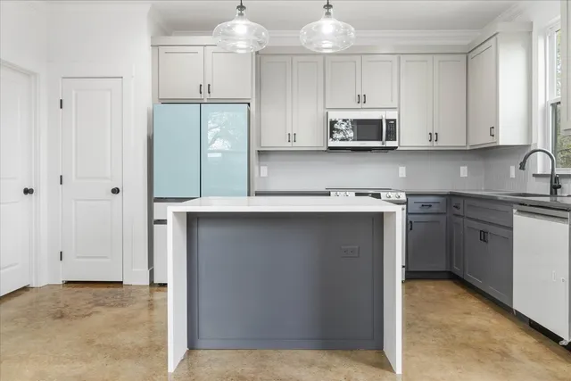 a kitchen with cabinets and window