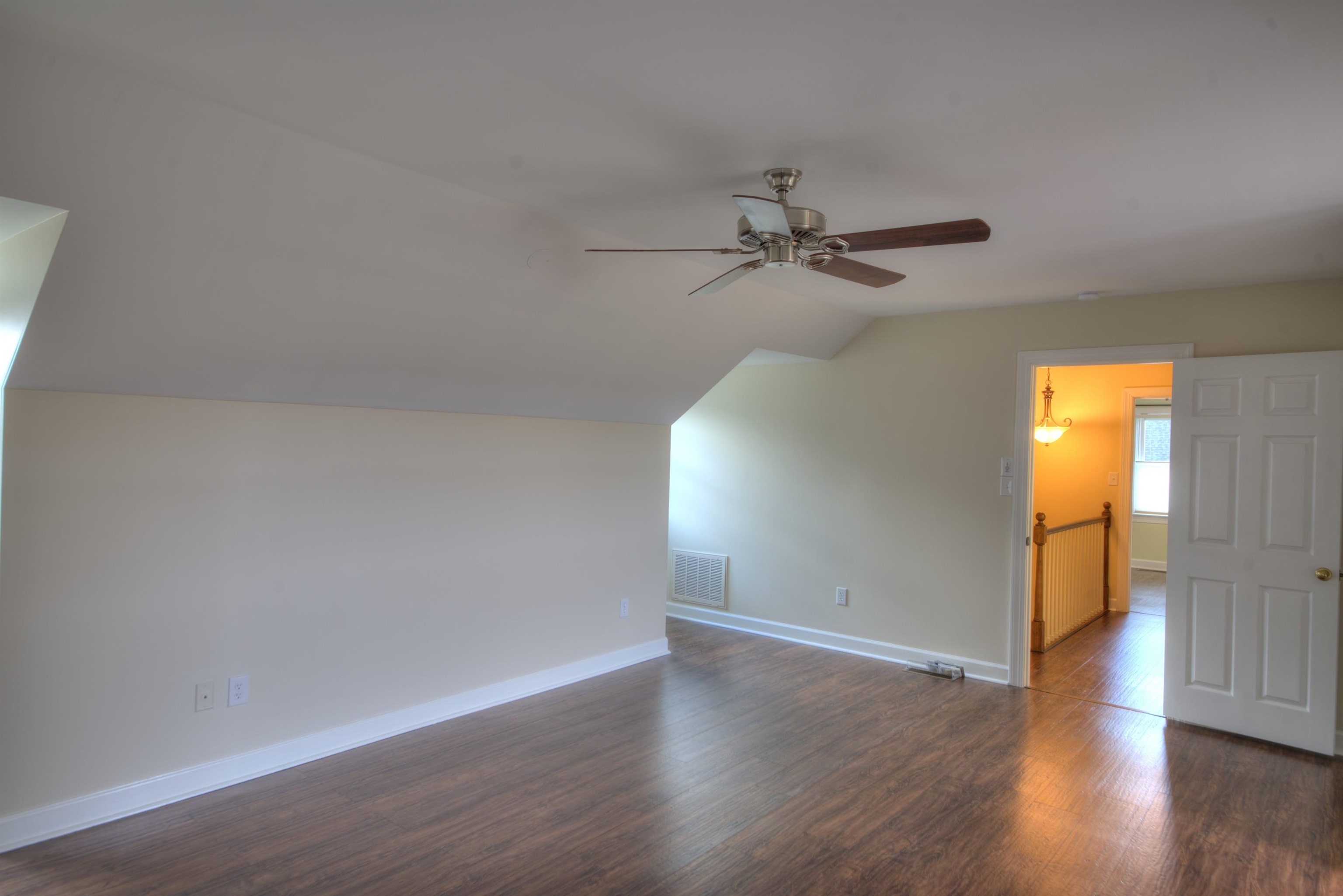 152 Huntington Place Waynesboro, VA 22980 - Photo 12 of 73 a view of a livingroom with wooden floor and a ceiling fan