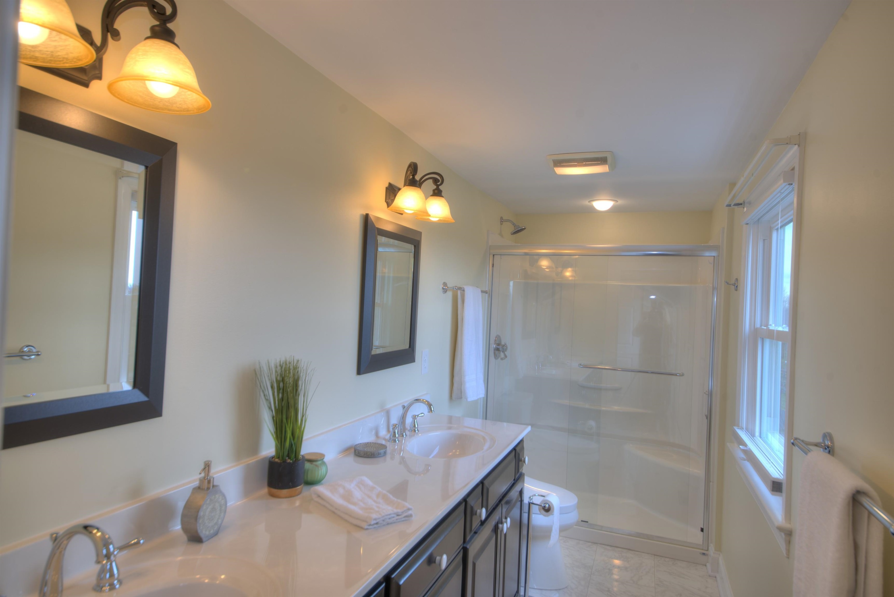 152 Huntington Place Waynesboro, VA 22980 - Photo 13 of 73 a bathroom with a sink vanity and a mirror
