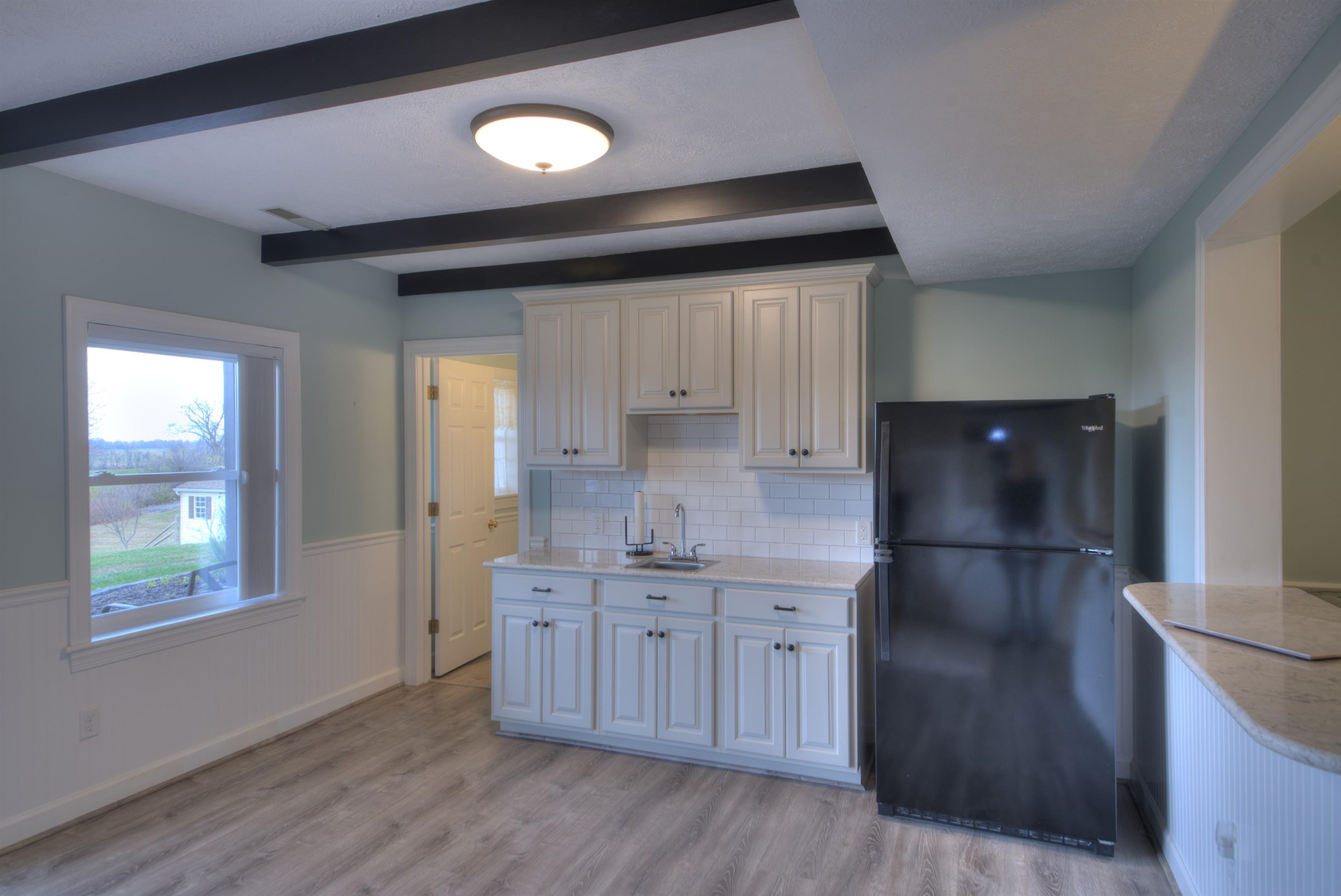 152 Huntington Place Waynesboro, VA 22980 - Photo 18 of 73 a kitchen with stainless steel appliances granite countertop a sink and a refrigerator