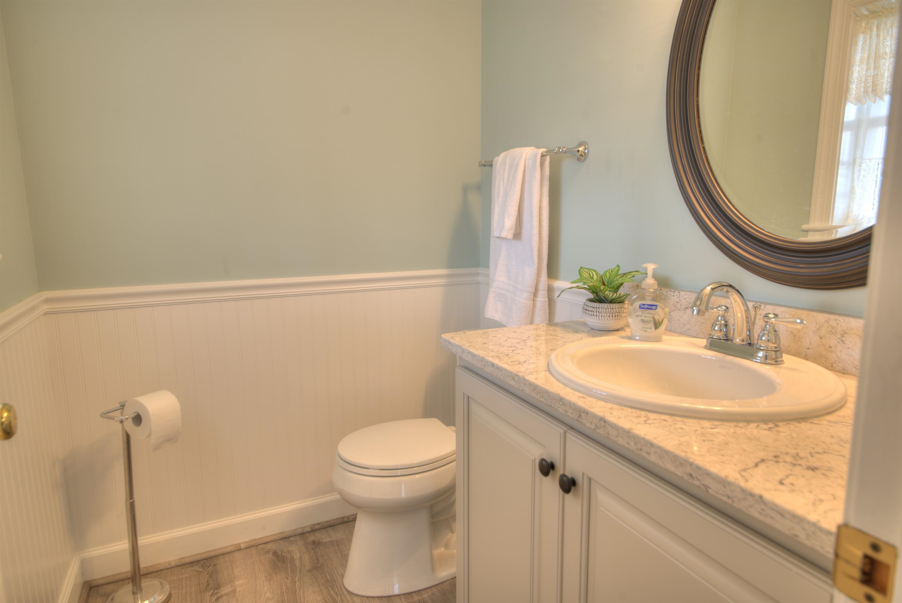 152 Huntington Place Waynesboro, VA 22980 - Photo 19 of 73 a bathroom with a granite countertop sink a toilet and a mirror