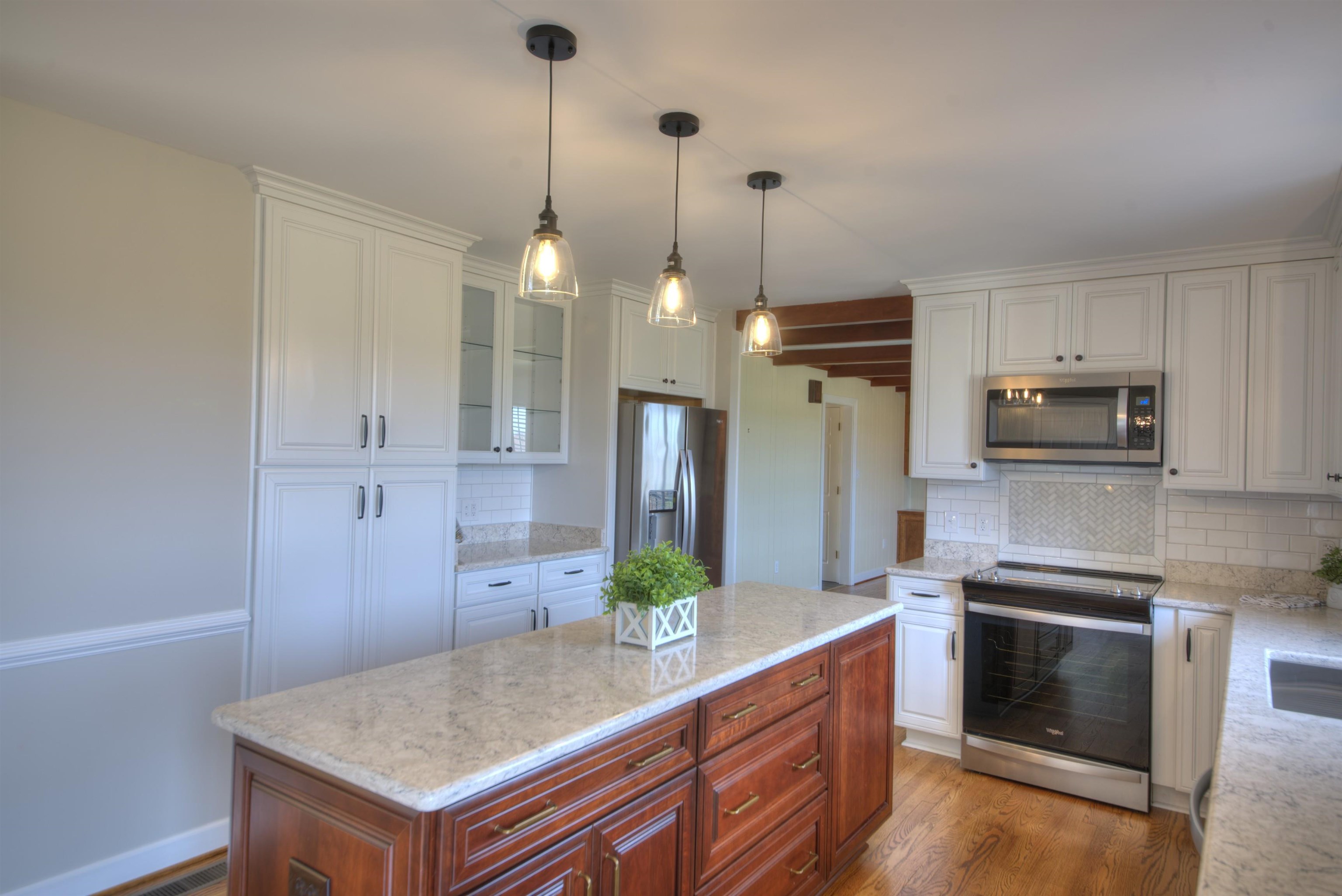 152 Huntington Place Waynesboro, VA 22980 - Photo 38 of 73 a kitchen with white cabinets and stainless steel appliances