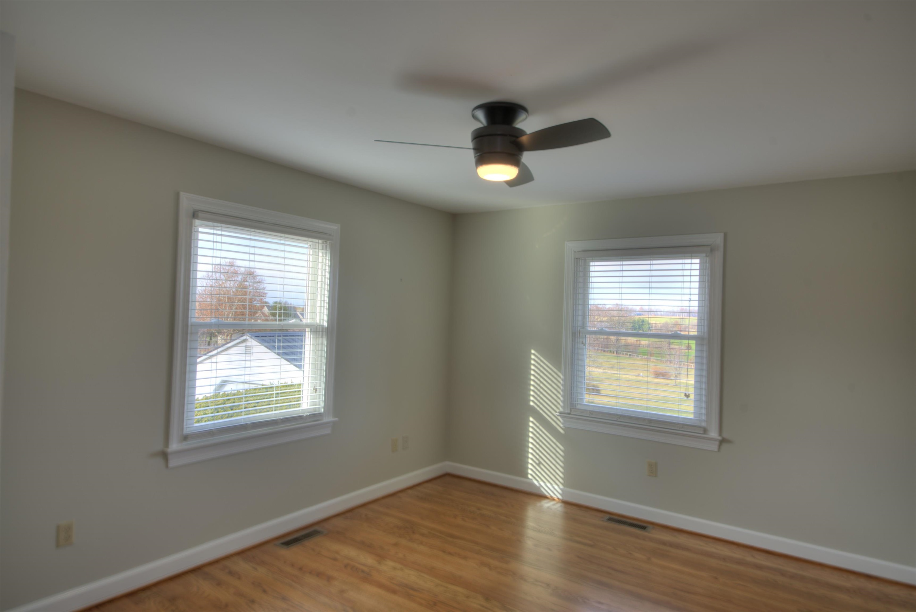 152 Huntington Place Waynesboro, VA 22980 - Photo 47 of 73 a view of an empty room with wooden floor and a window