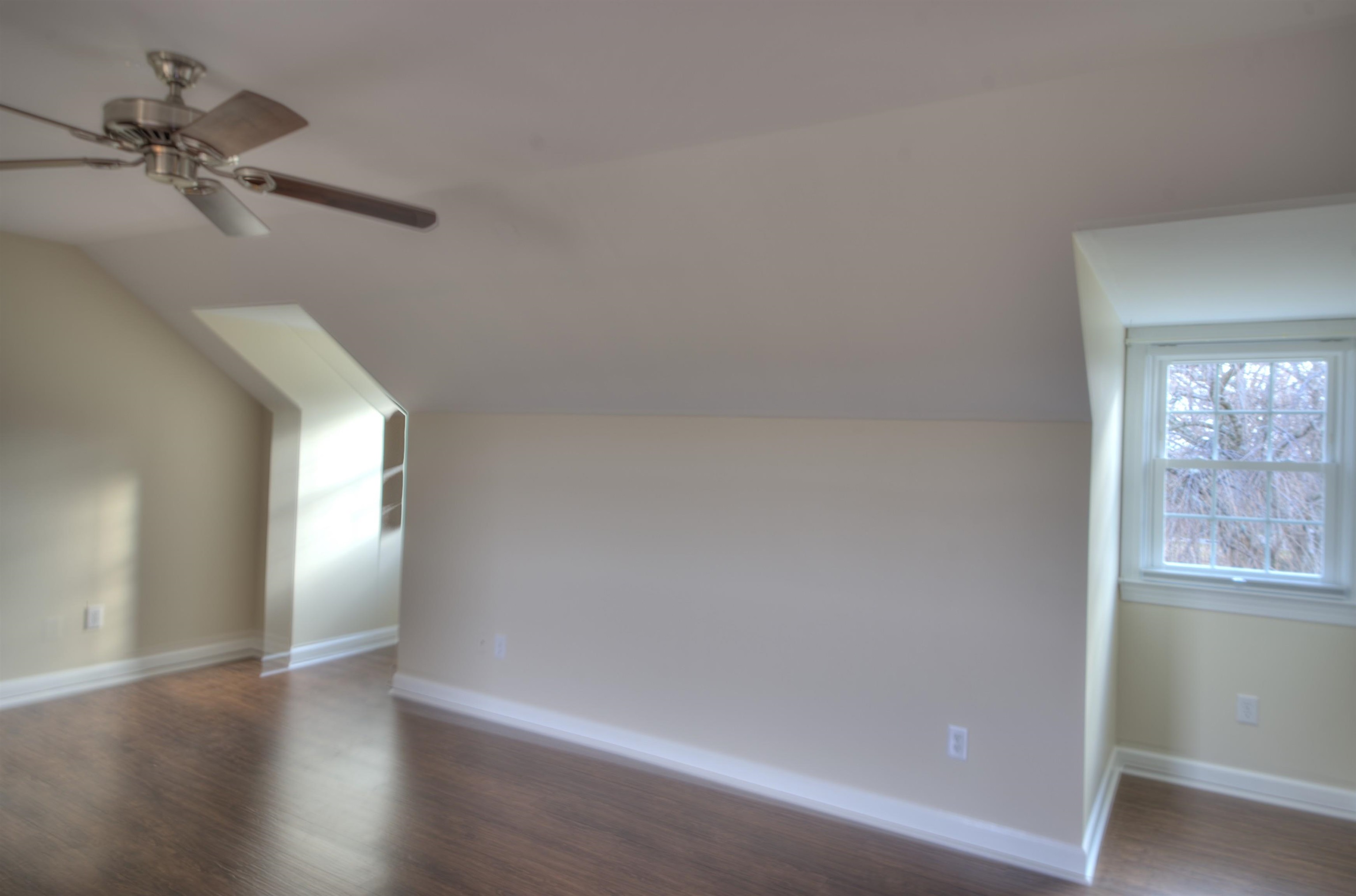 152 Huntington Place Waynesboro, VA 22980 - Photo 52 of 73 a view of a big room with wooden floor and windows