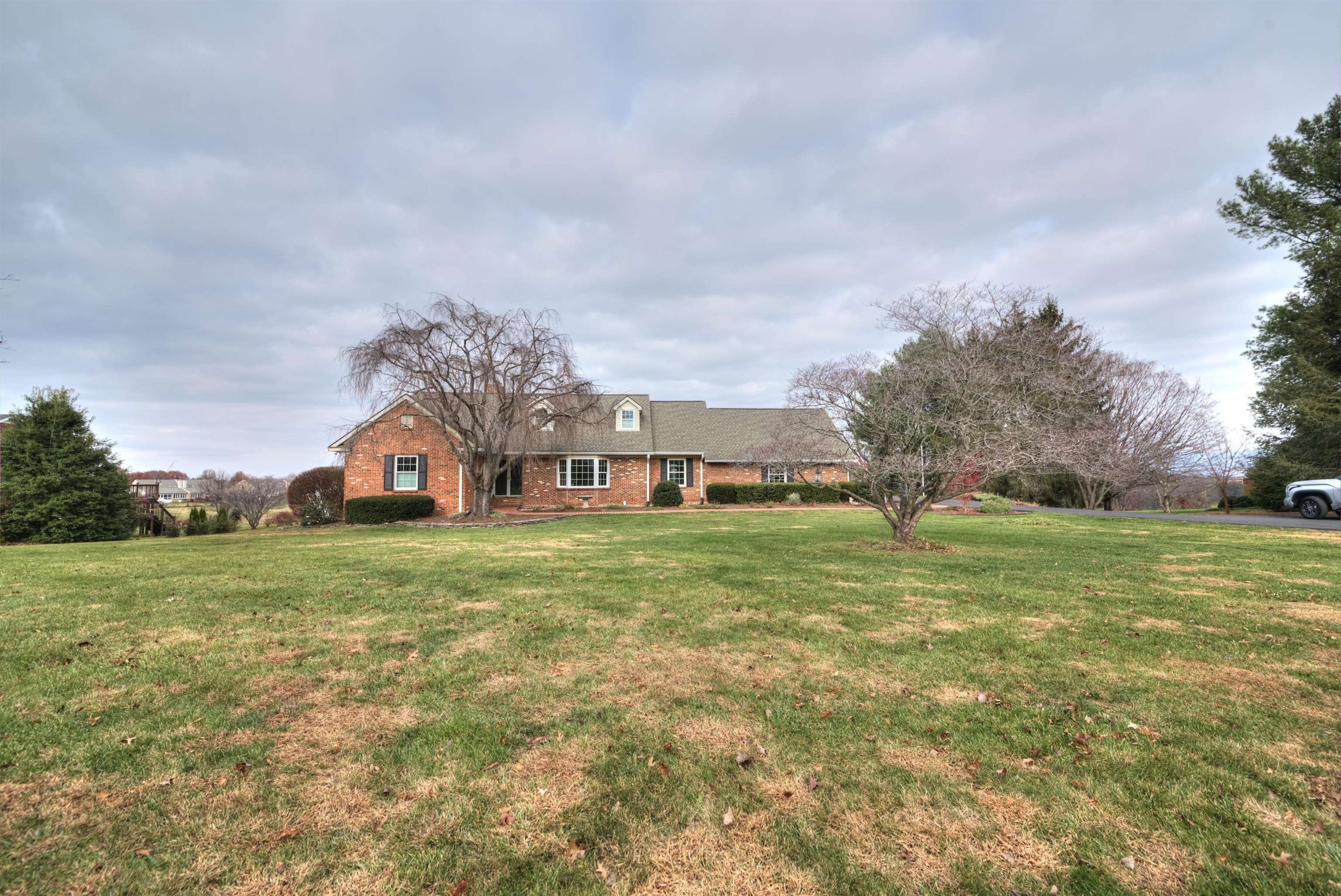 152 Huntington Place Waynesboro, VA 22980 - Photo 56 of 73 a front view of a house with a big yard and a large tree