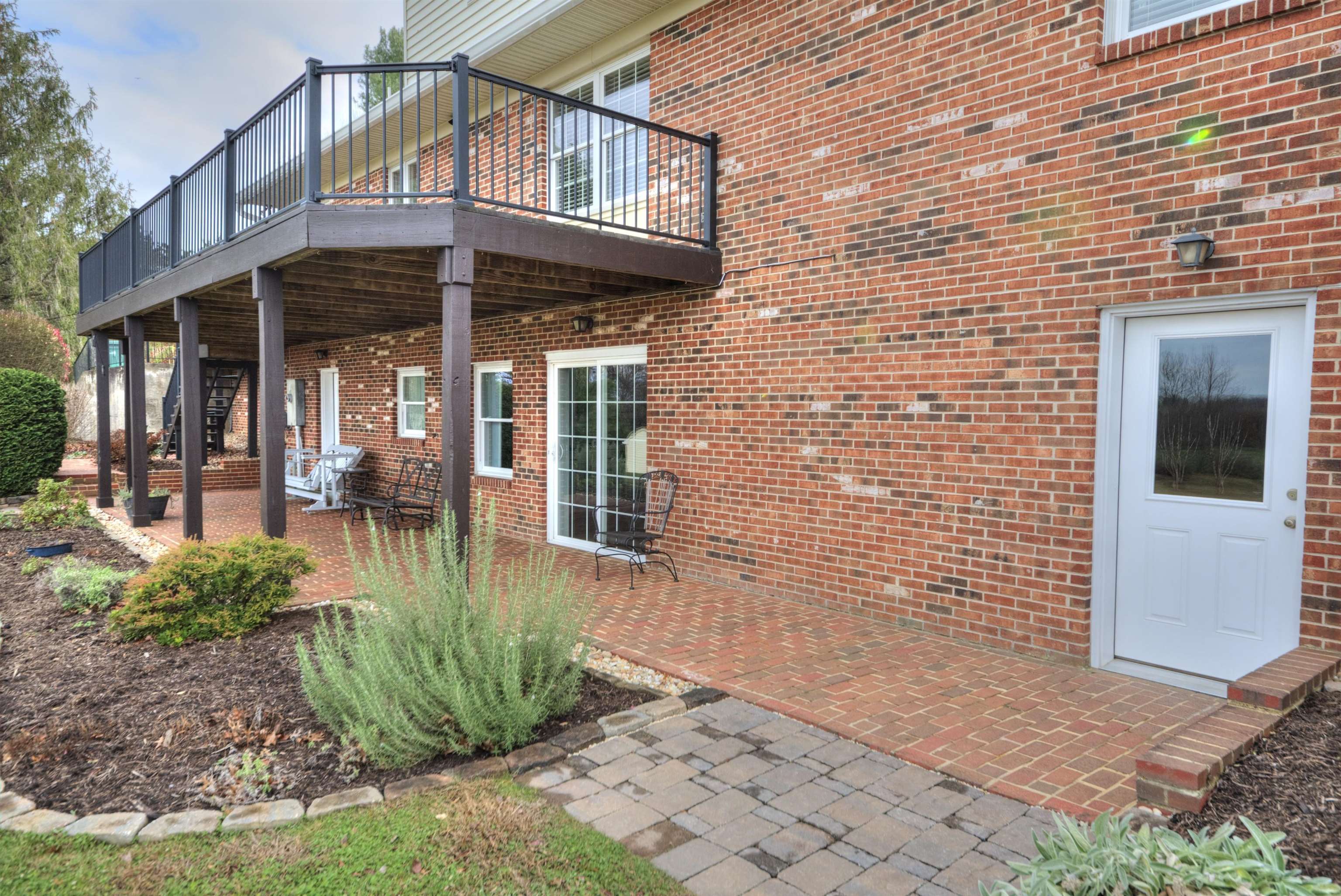 152 Huntington Place Waynesboro, VA 22980 - Photo 64 of 73 a view of a brick house with large windows and a table and chairs