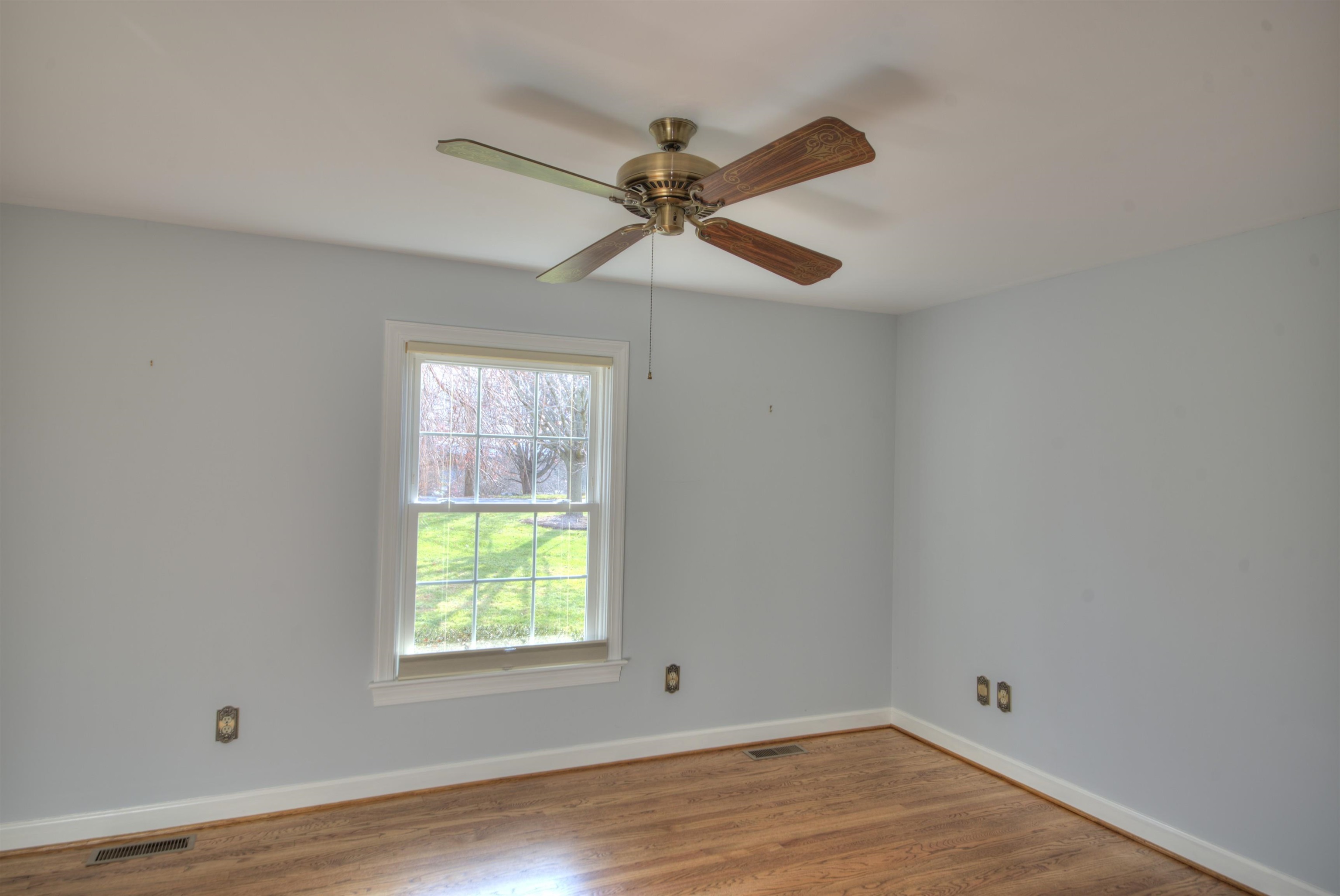 152 Huntington Place Waynesboro, VA 22980 - Photo 10 of 73 a view of empty room with wooden floor and fan