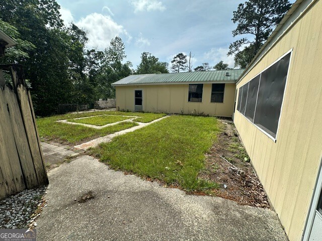 308 Three Rivers Lane Uvalda, GA 30473 - Photo 17 of 28 a front view of a house with garden