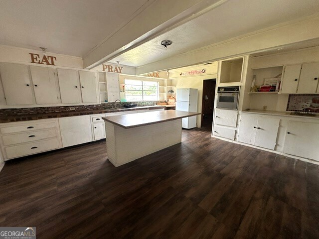 308 Three Rivers Lane Uvalda, GA 30473 - Photo 4 of 28 a large kitchen with granite countertop a sink and cabinets