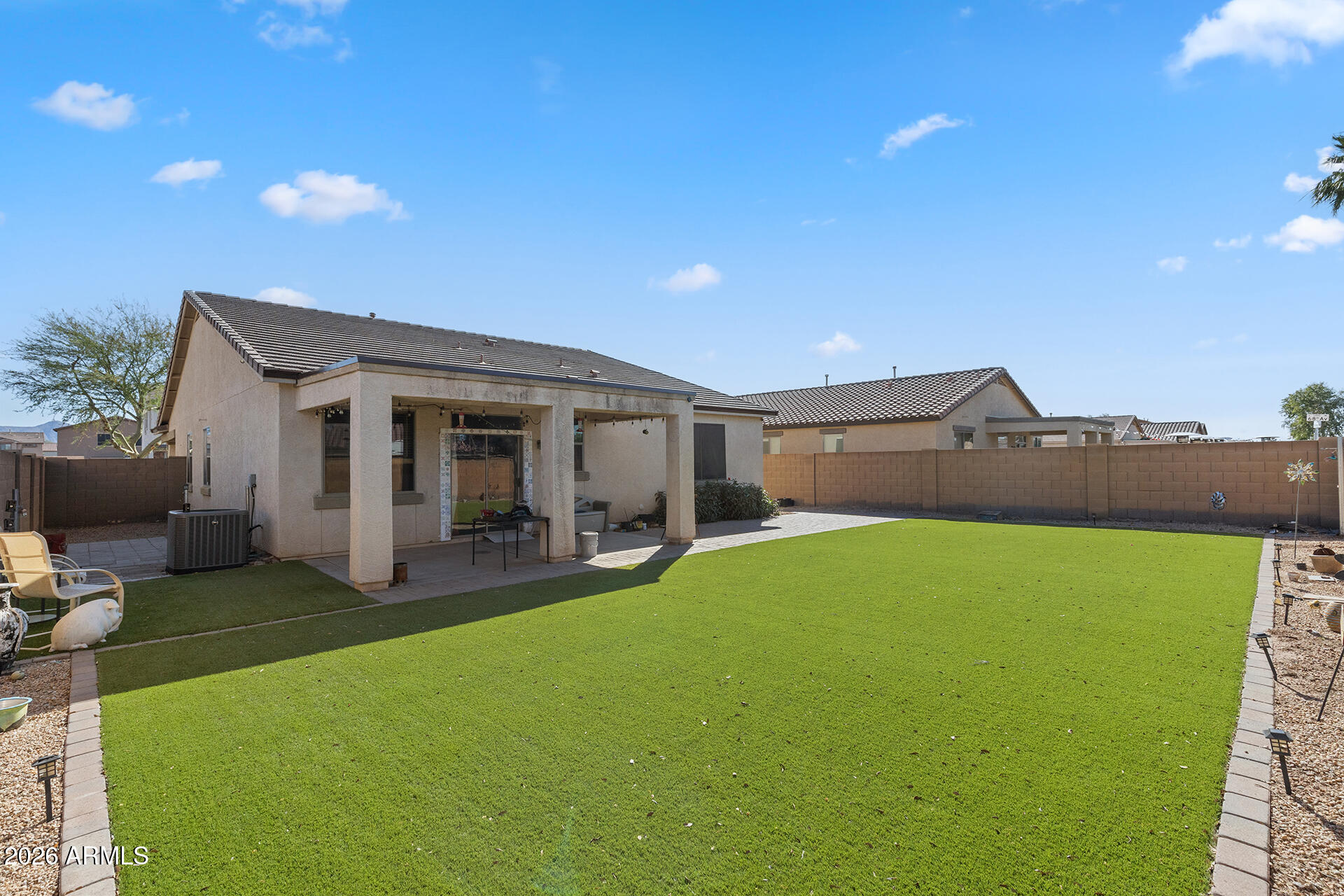 6718 West Darrel Road Laveen, AZ 85339 - Photo 47 of 49 a view of a house with a yard and sitting area