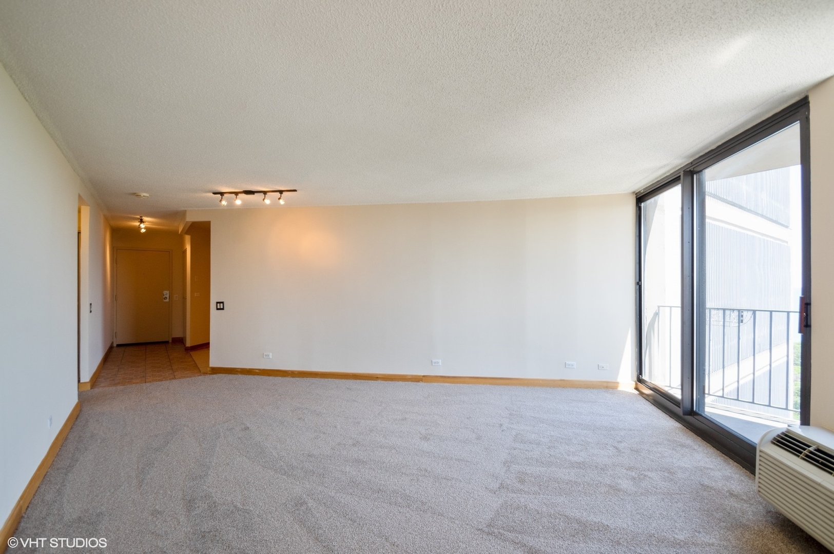 5320 North Sheridan Road, Unit 2003 Chicago, IL 60640 - Photo 2 of 10 a view of an empty room with a window