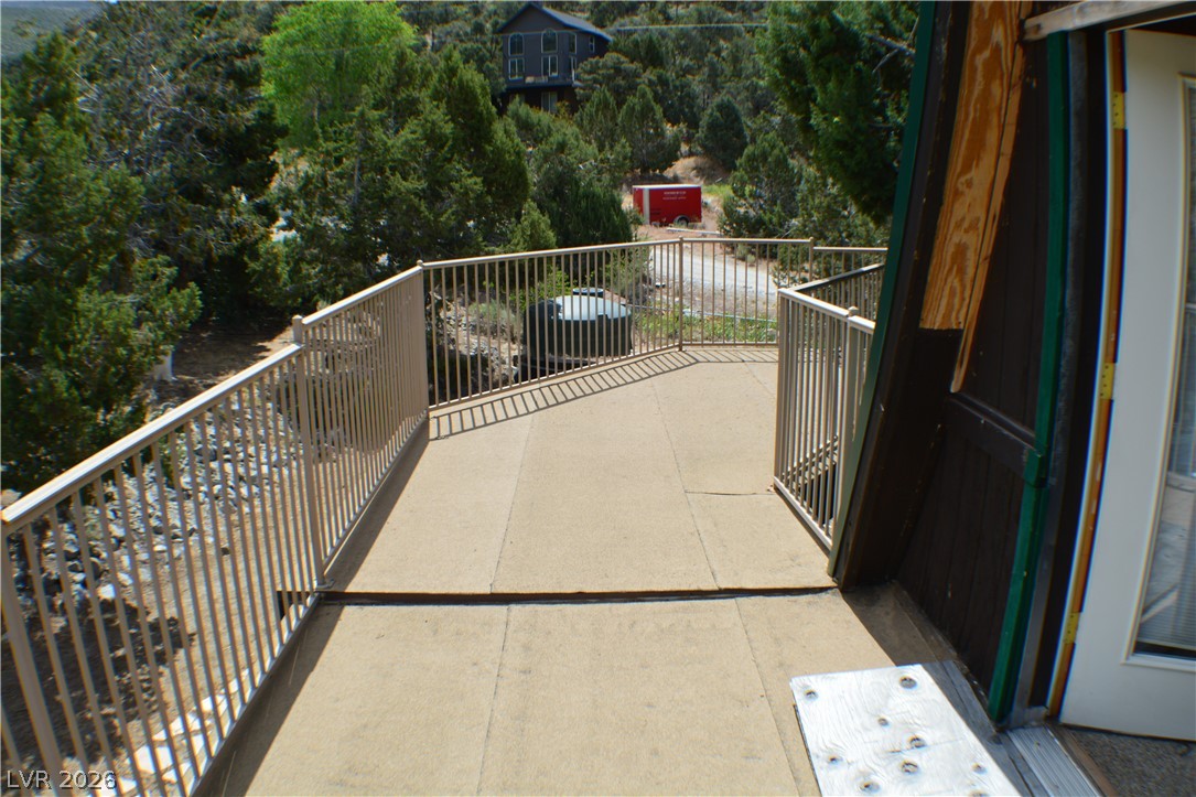 1321 Trout Canyon Road Las Vegas, NV 89124 - Photo 34 of 50 Embrace mountain living from this secluded deck offering scenic, tree-filled views.