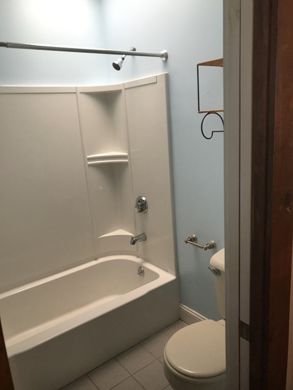 100 4th Avenue Lowell, MA 01854 - Photo 6 of 12 a bathroom with a toilet and a bathtub
