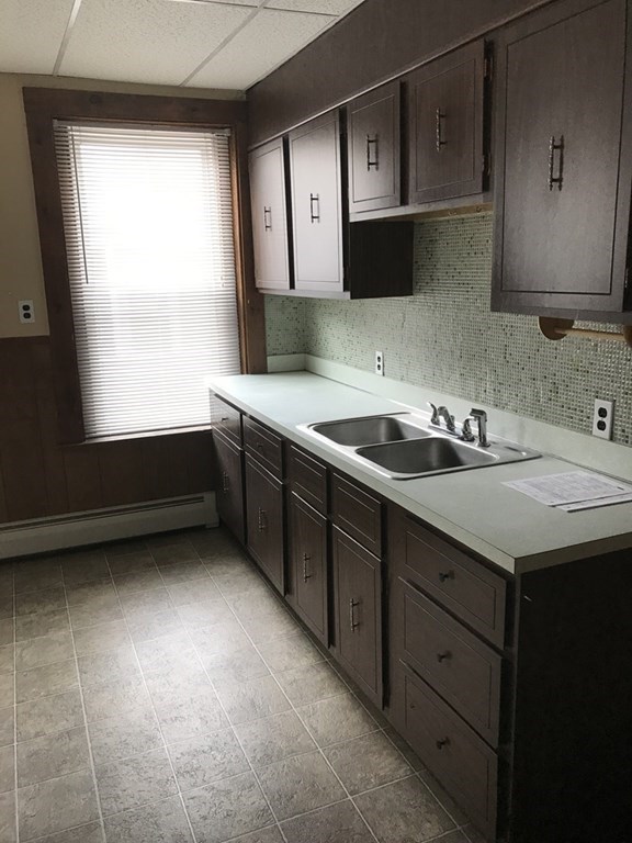 100 4th Avenue Lowell, MA 01854 - Photo 8 of 12 a kitchen with a sink and a window