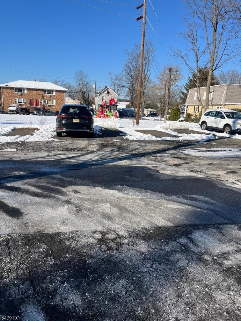 136 East Main Street, Unit 1 Little Falls, NJ 07424 - Photo 2 of 11 a view of street with parked cars