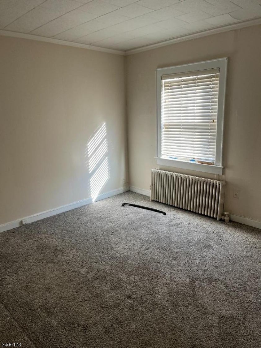 136 East Main Street, Unit 1 Little Falls, NJ 07424 - Photo 5 of 11 an empty room with a window