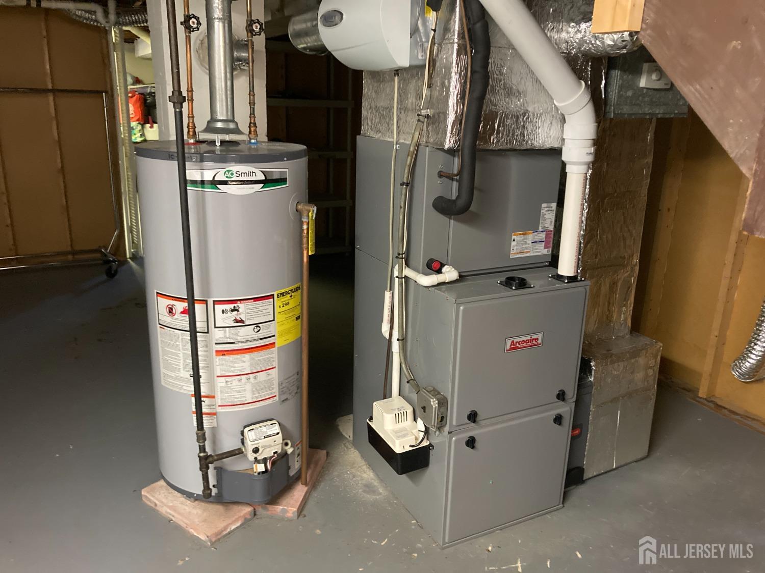 60 Edwards Road Brick, NJ 08723 - Photo 12 of 49 a room with water heater and wooden cabinets