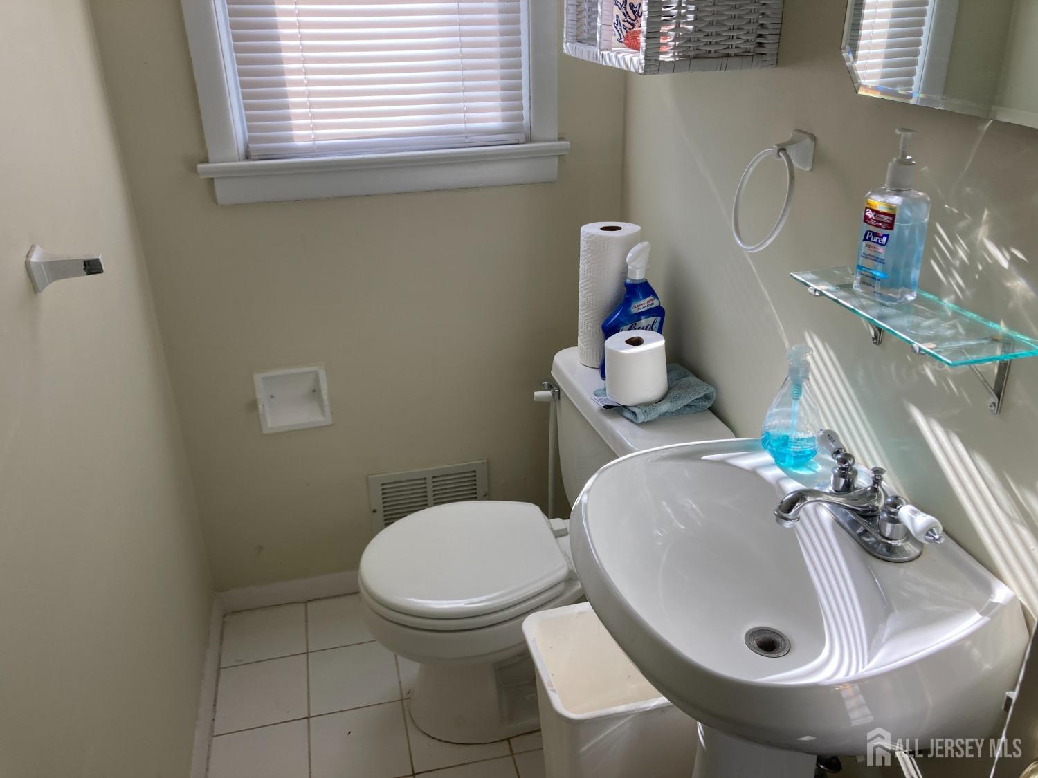 60 Edwards Road Brick, NJ 08723 - Photo 15 of 49 a bathroom with a sink toilet and a mirror