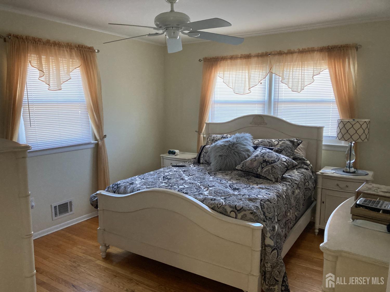 60 Edwards Road Brick, NJ 08723 - Photo 17 of 49 a bedroom with a bed and large windows