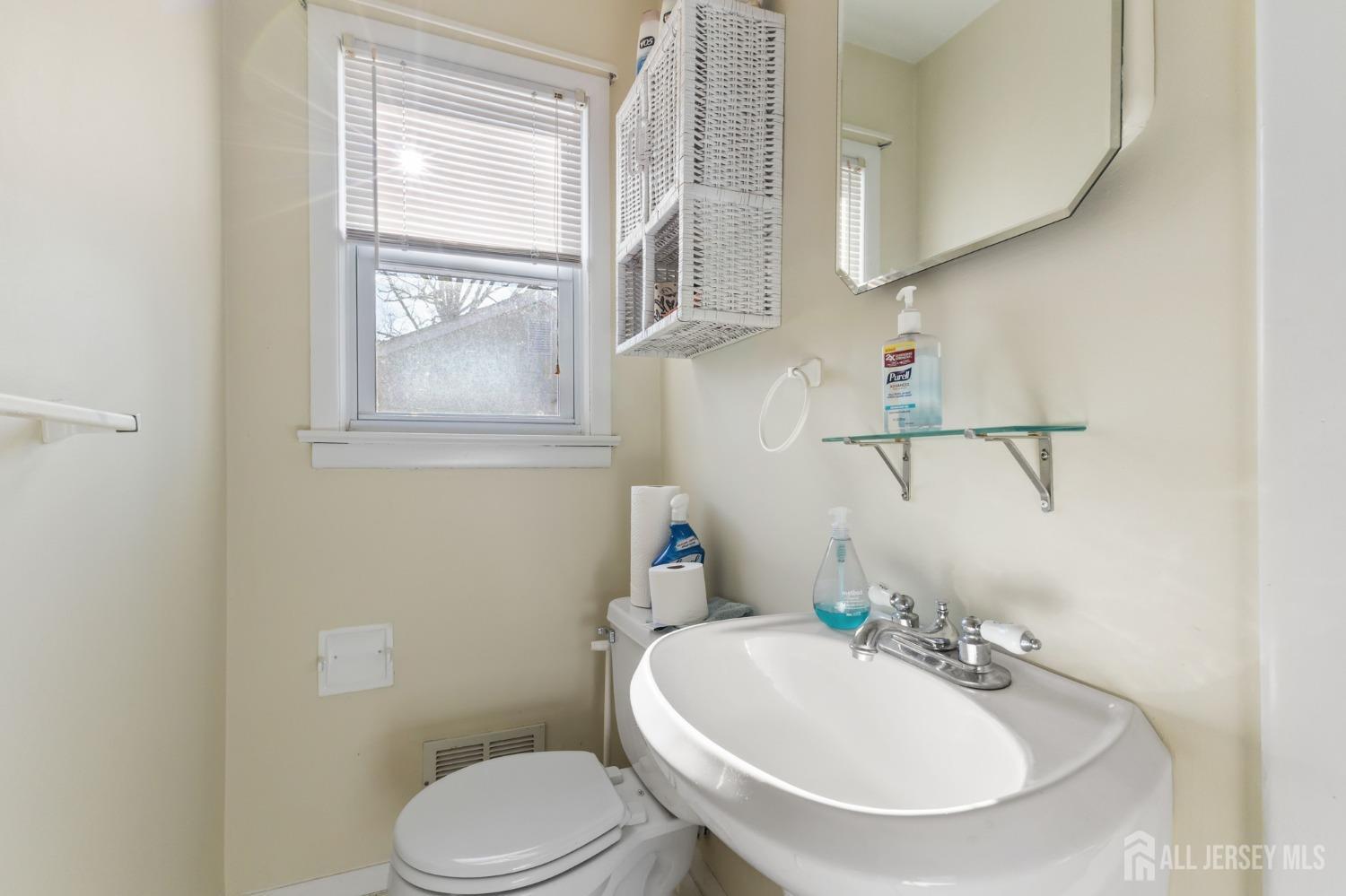 60 Edwards Road Brick, NJ 08723 - Photo 22 of 49 a bathroom with a sink a toilet and a mirror