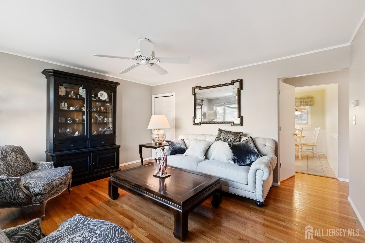 60 Edwards Road Brick, NJ 08723 - Photo 29 of 49 a living room with furniture a table and wooden floor