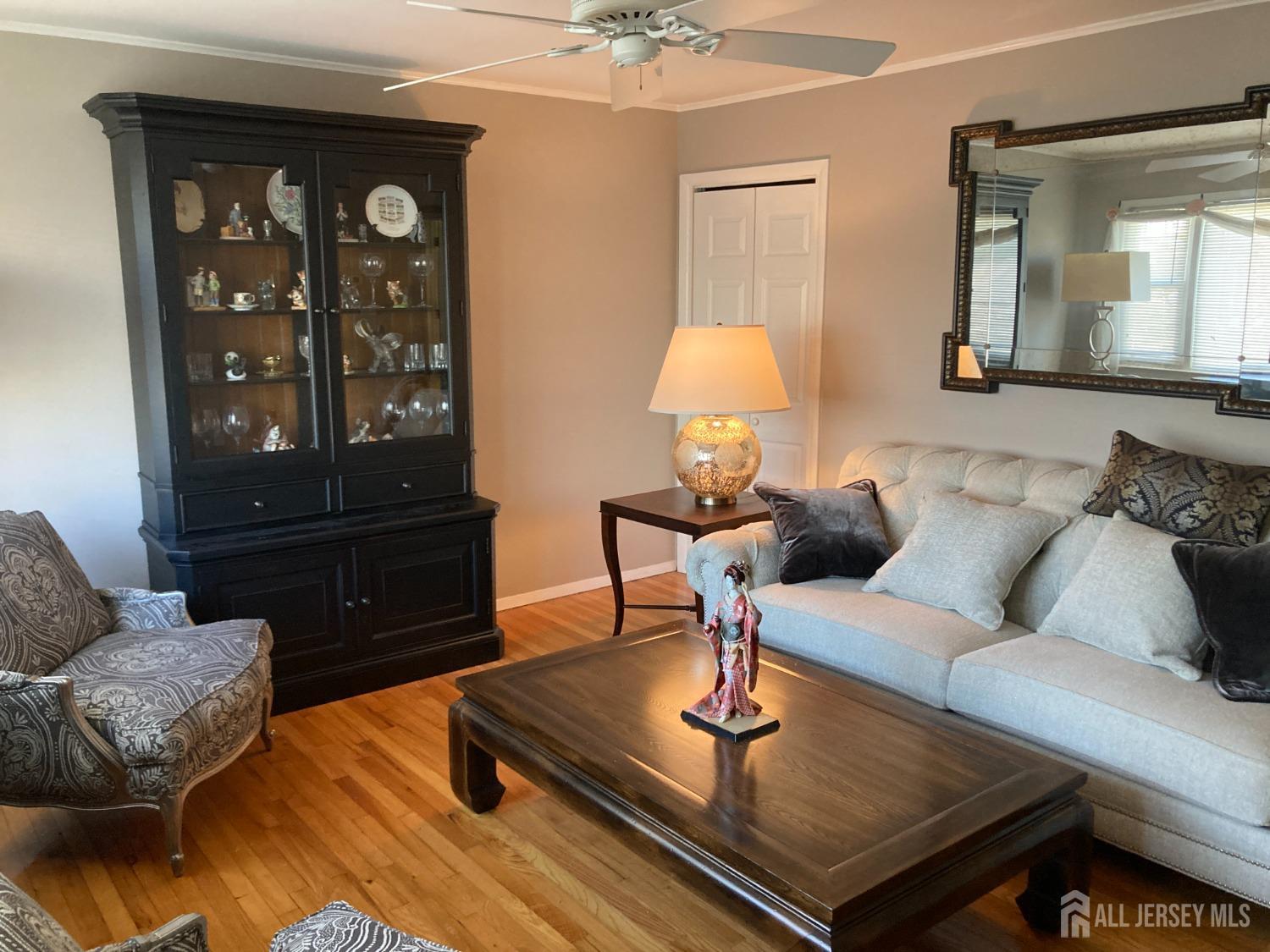 60 Edwards Road Brick, NJ 08723 - Photo 3 of 49 a living room with furniture and a lamp