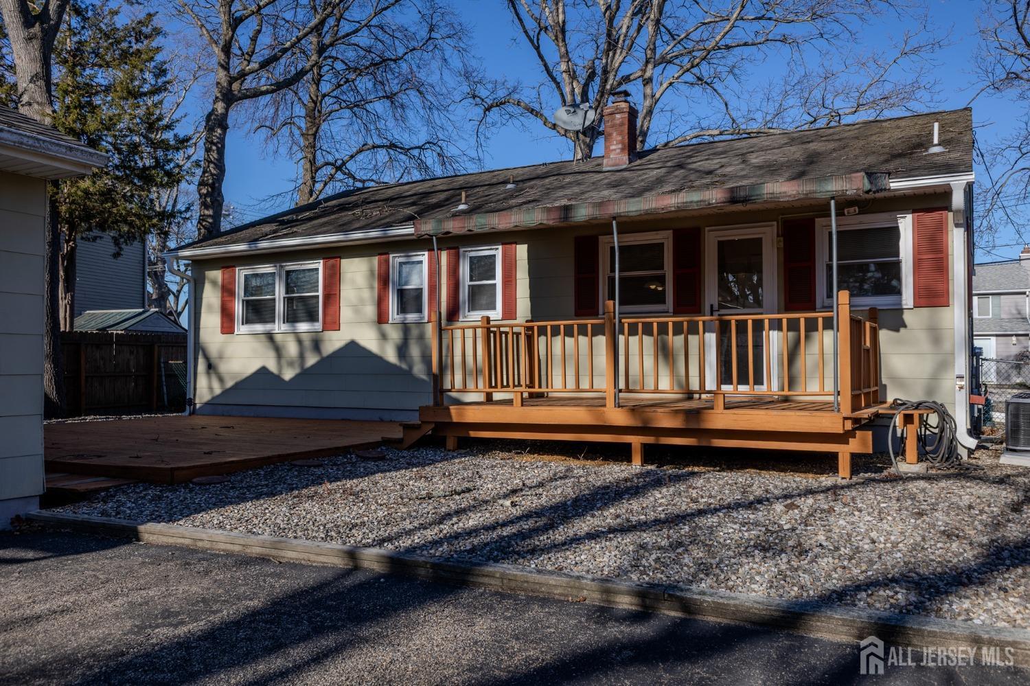 60 Edwards Road Brick, NJ 08723 - Photo 36 of 49 a view of a house with a yard and wooden floor