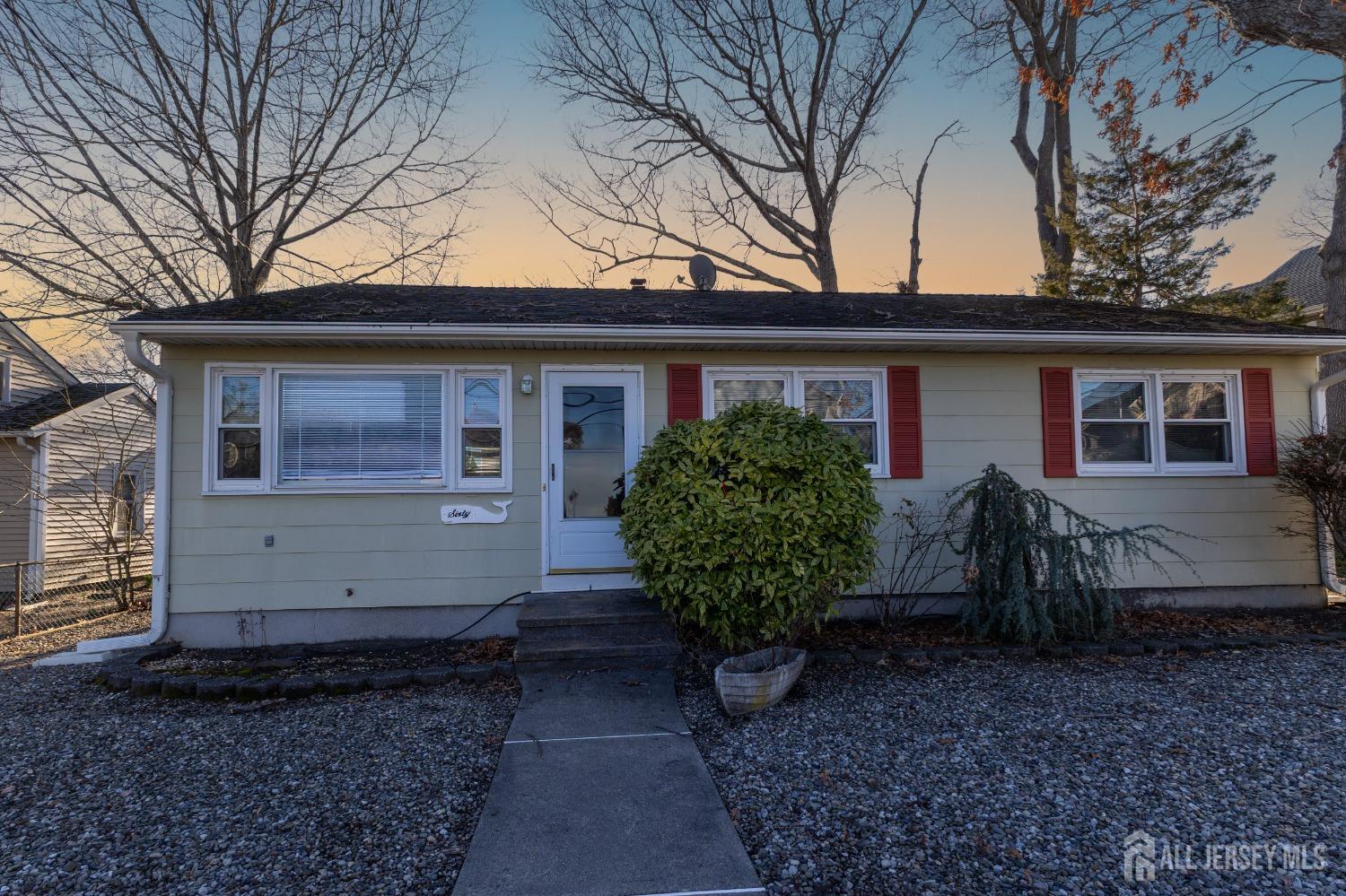 60 Edwards Road Brick, NJ 08723 - Photo 39 of 49 a house with trees in front of it
