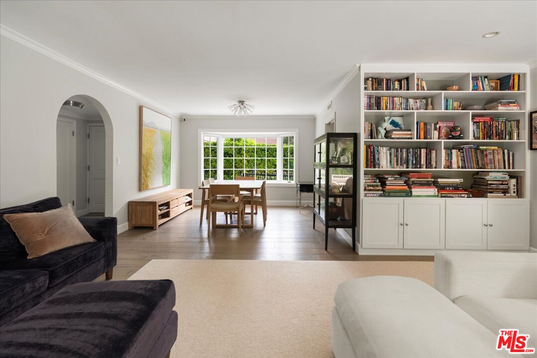 3479 Mandeville Canyon Road Los Angeles, CA 90049 - Photo 14 of 55 a living room with furniture and view of kitchen