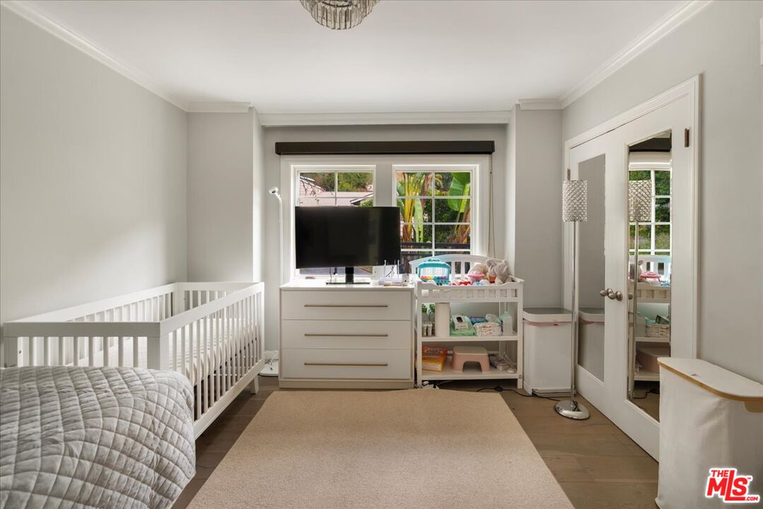 3479 Mandeville Canyon Road Los Angeles, CA 90049 - Photo 22 of 55 a view of room with balcony and furniture