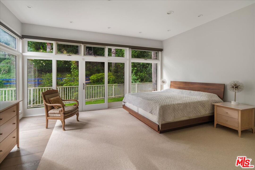3479 Mandeville Canyon Road Los Angeles, CA 90049 - Photo 23 of 55 a bedroom with a bed and a window