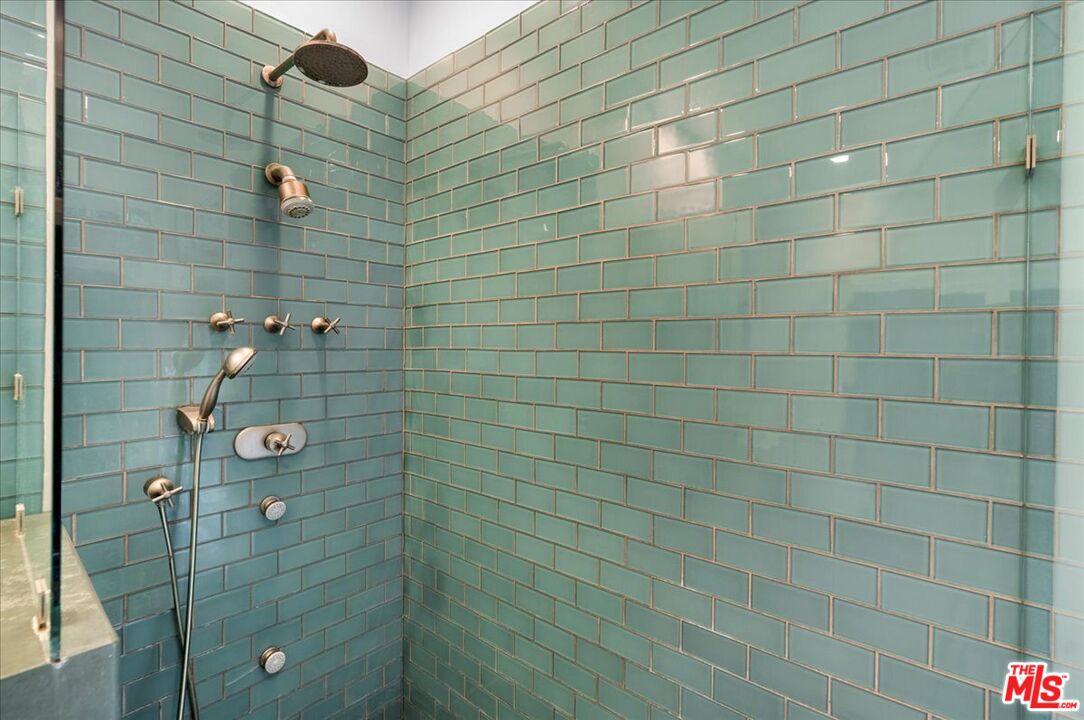 3479 Mandeville Canyon Road Los Angeles, CA 90049 - Photo 31 of 55 a bathroom with a shower