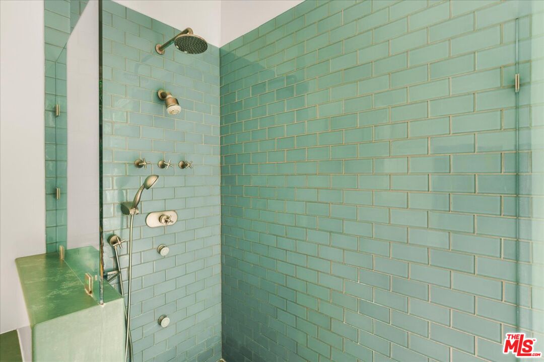 3479 Mandeville Canyon Road Los Angeles, CA 90049 - Photo 32 of 55 a bathroom with a shower and a sink